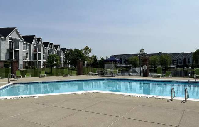 Relaxing Swimming Pool with Lounge Chairs at Liberty Mills Apartments, Fort Wayne, IN, 46804