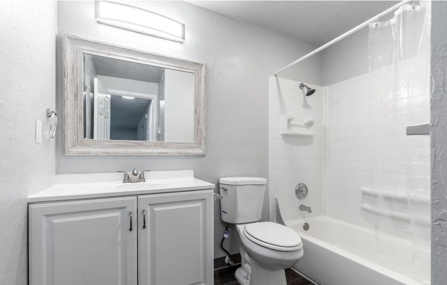 a bathroom with a sink toilet and a bath tub