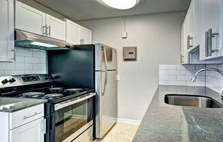 White Kitchen with Stainless Steel  at Lock Vista, Seattle, 98107