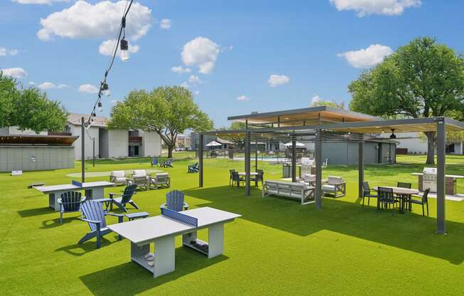 a rendering of a park with tables and chairs and a pavilion