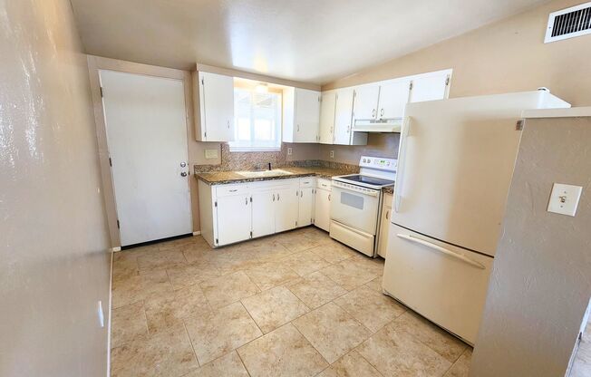 Charming 2 Bed 1 Bath Duplex w/Private Yard & Off-street Parking!