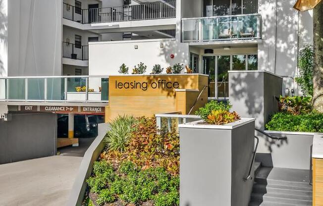 A leasing office is situated in a landscaped courtyard.