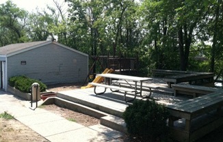 a patio with a picnic table and a fire hydrant