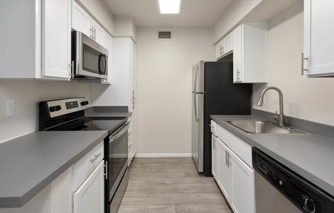 apartment kitchen with stainless steel appliances at Paseo 51, Glendale, 85302