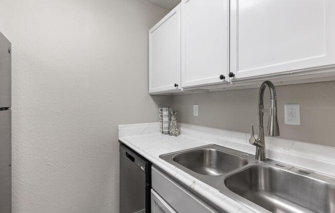 a kitchen with a sink and a microwave