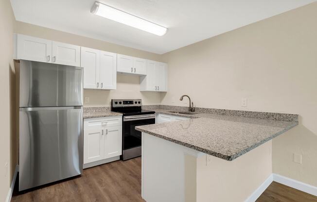 Addison Lane apartments in Gainesville, FL photo of stainless steel appliances