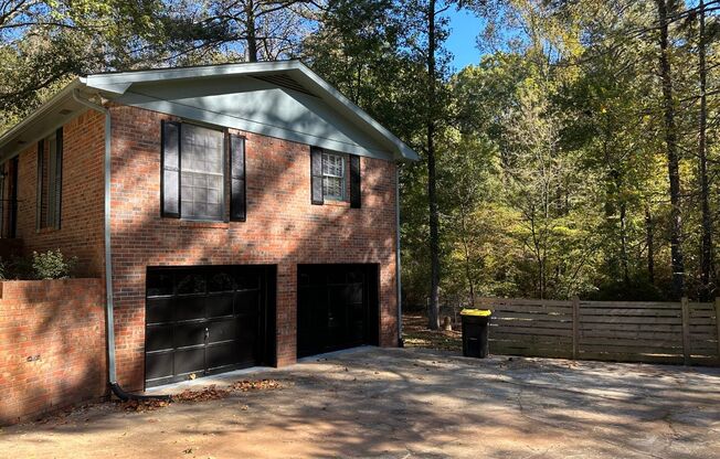 4 bed, 3 full baths, two living areas or in-law/teen suite, 2 car garage, lots of parking, private & wooded LOT! Must see!