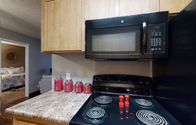 Kitchen with black appliances at Glen at Hidden Valley, Nevada