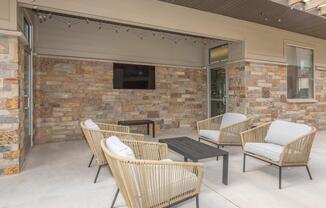 a living room filled with furniture and a fireplace