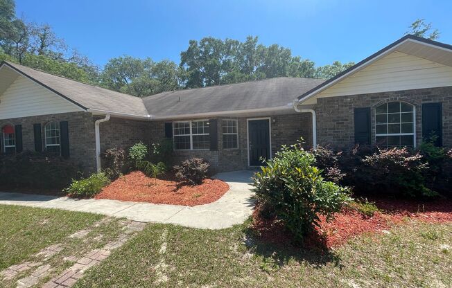 3/2 (Fort White) Welcome to this beautiful 3-bedroom home nestled on 8.1 acres of lush land, providing a perfect blend of comfort and tranquility