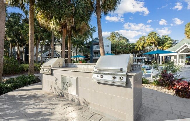 Outdoor Grilling Area at Caribbean Breeze Apartments in Tampa, FL.