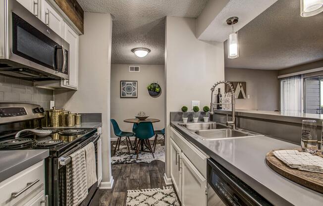 a kitchen with a sink and a window