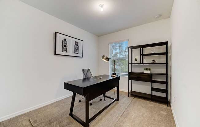 Boatman Hammock Townhomes in Lake Worth, FL photo of  a home office with a desk and a bookshelf