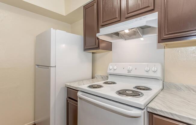 a kitchen with a stove top oven sitting inside of a refrigerator