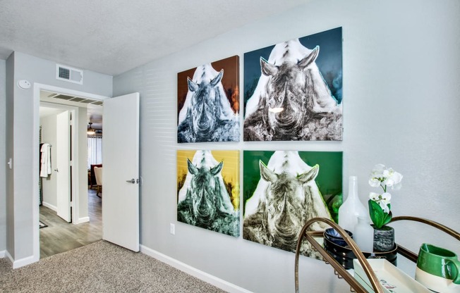 a wall with four pictures of a horse on itat The Julia, Mesa Arizona