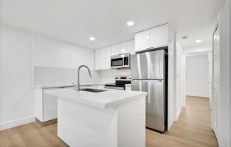 New Renovated Building! 1 Bd/1 Ba, quartz countertops, washer/dryer, stainless steel appliances, 1 parking space.