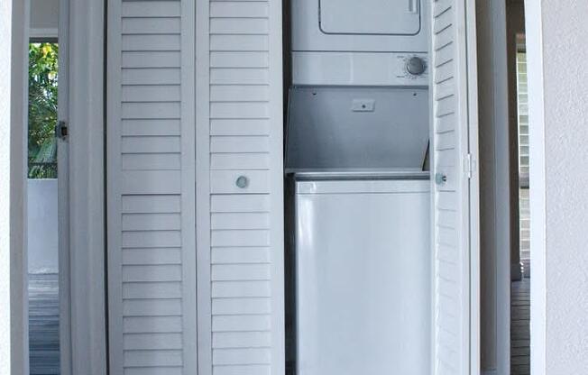 Napili Towers laundry closet with stackable machines