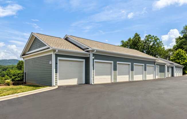 a row of garages with a blue sky in the background