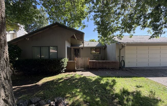 Spacious 3 Bedroom Home with Multiple Living Areas, Two Fireplaces, Hardwood Floors & Outdoor Patio