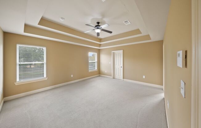 3 Bedroom home with a Bonus area! Sits on a Lake with a fenced yard!