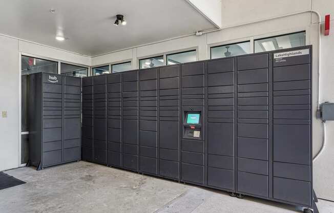 a row of black inmate lockers in a building