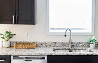 Kitchen with dark cabinets and granite countertops at Hudson Ridge, Red Lion, PA, 17356