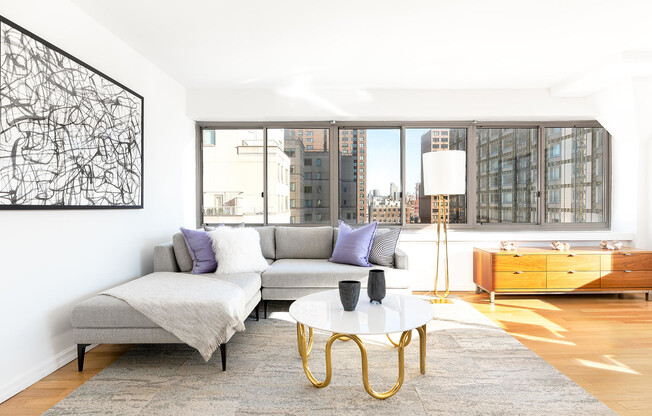 bright model penthouse apartment featuring wall to wall windows at The Fairfax