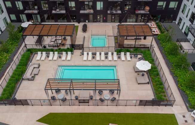 a view of the pool from the roof of an apartment building
