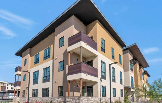 a new apartment building with a triangular roof on top of itat Solace at Ballpark Village, Goodyear