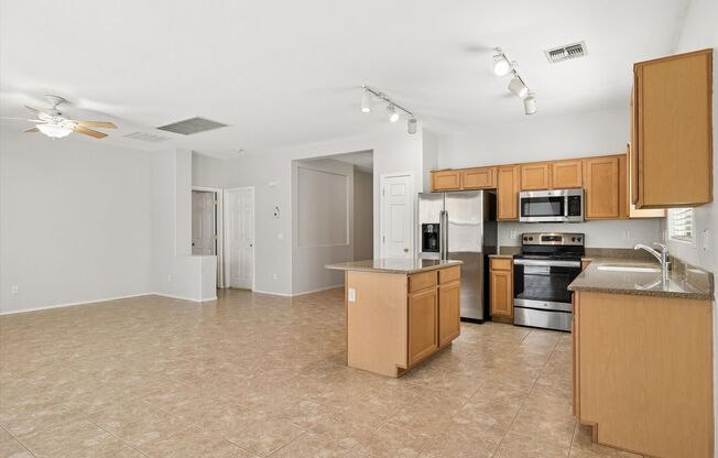 Great 3 bedroom split floor plan in Rogers Ranch, 2 car garage, Tile except in Bedrooms!!!  All appliances with pantry, Island and good storage!!!  Available NOW!!!