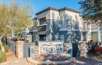 a building with a club sign in front of it