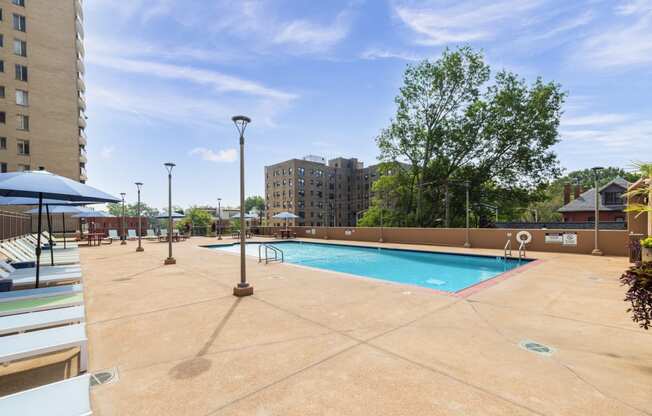 this is a photo of the pool area at harvard square apartments in dallas, tx