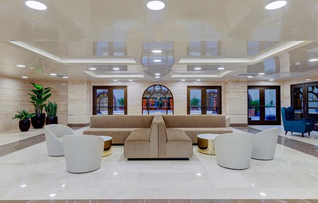 a living room filled with furniture and a large window