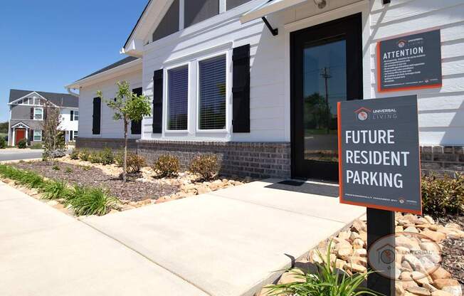 A sign in front of a house that says Future Resident Parking.