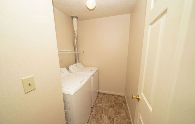 laundry room with a washer and dryer in it at Brentwood Park Apartments, La Vista, Nebraska