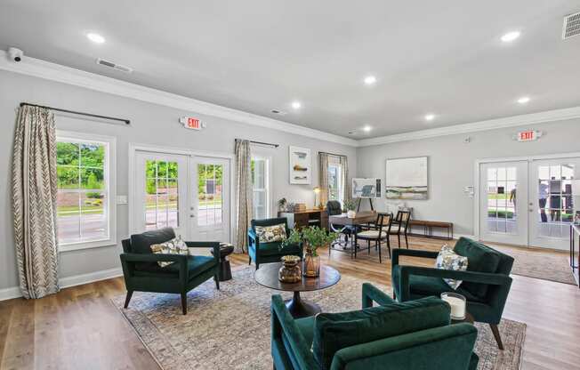 a living room with couches and chairs and a table