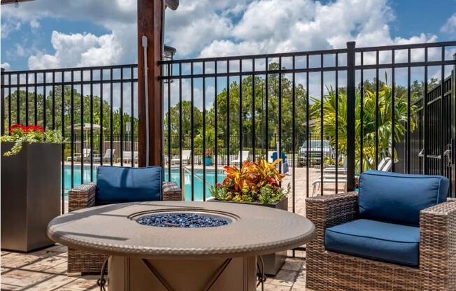 A fire pit with chairs at the Flats at Sundown in North Port, Florida