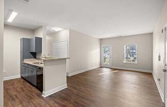 A kitchen area with a counter and cabinets.