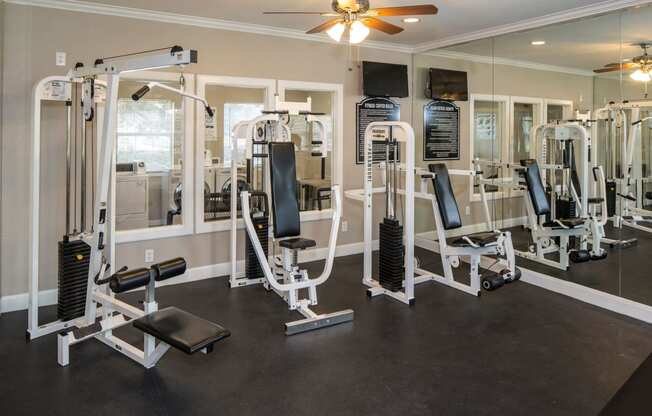 a photo of a fitness room with cardio equipment