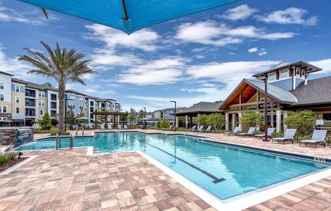 a swimming pool with a blue sky above it