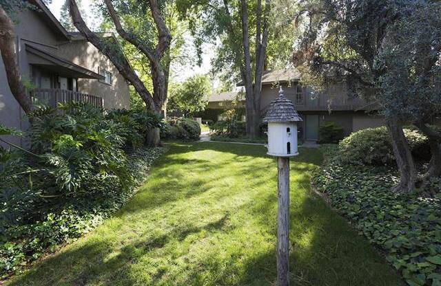 a bird house in a garden