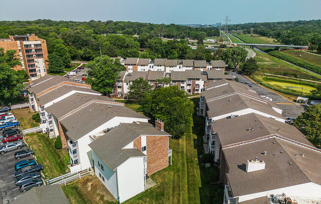 arial view of a housing complex with trees in the background