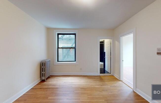 207 209 W 11 ST