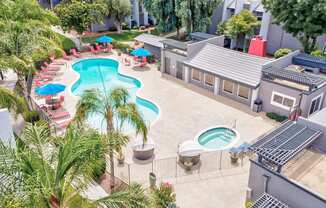 an aerial view of a pool and a resort style swimming pool