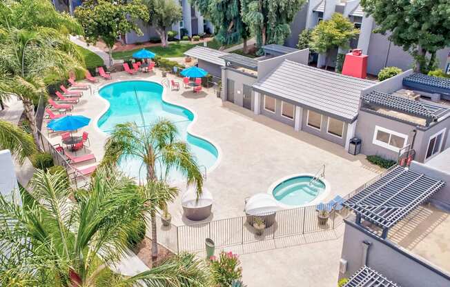 an aerial view of a pool and a resort style swimming pool