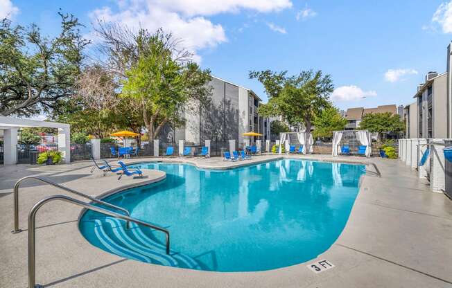 the swimming pool at the enclave apartments