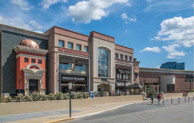 A building with a pig on the front has a sign that says Urban Plates.