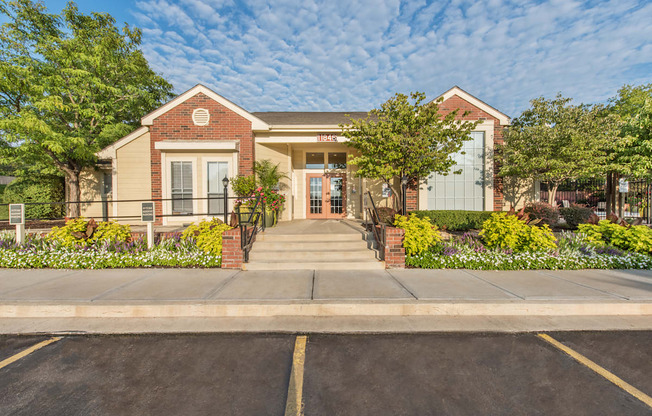 a house with a sidewalk in front of it at Highland Ridge Apartments, Overland Park , Kansas