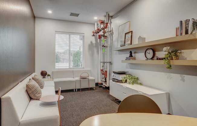 business room with white furniture and a table