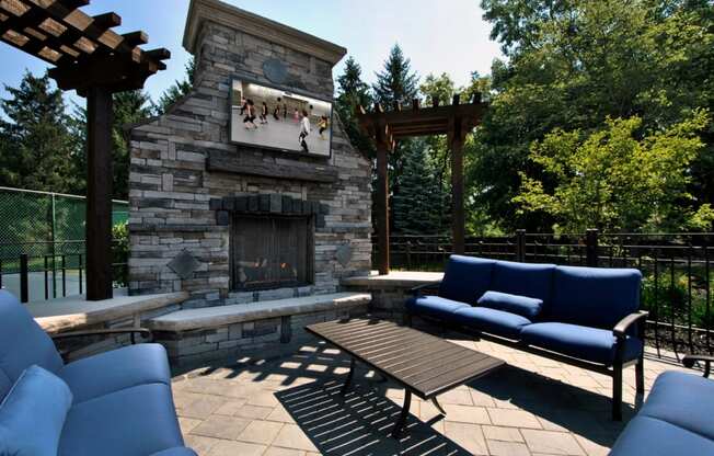Outdoor TV Lounge with Fireplace at The Haven of Ann Arbor, Michigan